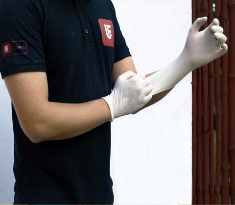 UNIFIX guy pulling white gloves